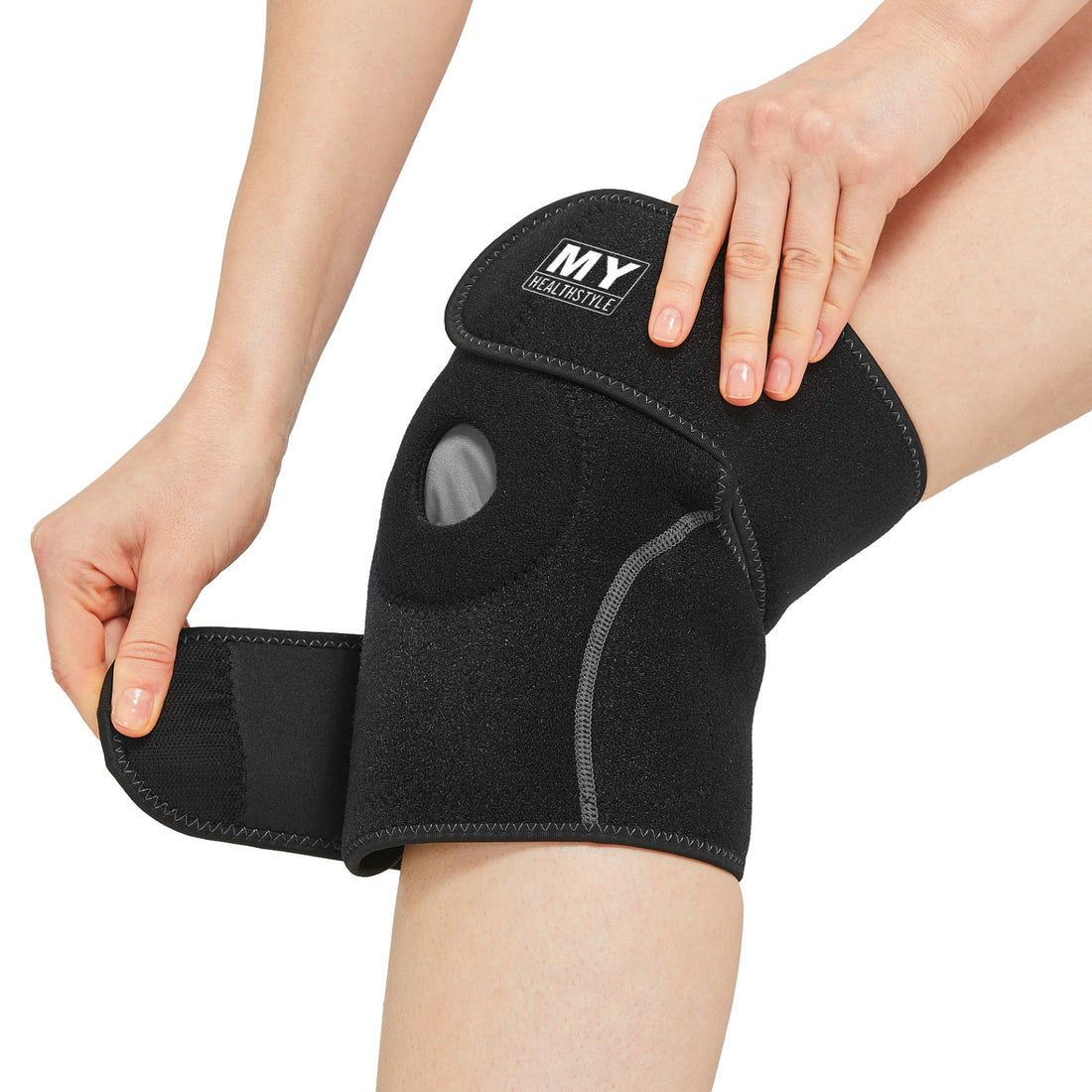 Black MY Healthstyle knee wrap being fitted around the knee